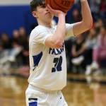 TMHS junior Samuel Lockhart dons a larger teammate's jersey while knocking down a free throw late in a home win against Ketchikan. (Ben Hohenstatt / Juneau Empire)