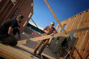 Lucy consults with Builder Nic Howell on float house construction issues. (Courtesy Photo / Lucy Moline-Robinson)