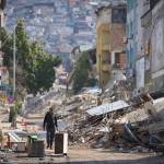A man walks past destroyed buildings in Antakya, southeastern Turkey, Tuesday, Feb. 21, 2023. Douglas Mertz writes that the disaster offers lessons for Alaska's capital city. (AP Photo / Unal Cam)
