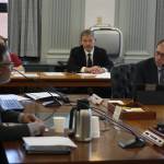 State Sen. Jesse Kiehl, D-Juneau, right, asks Ajay Desai, director of the Alaska Division of Retirement and Benefits, about the assumptions used to calculate pensions earned by state employees under a fixed-amount plan in effect until 2006 and a subsequent 401K-type plan during a Senate Finance Committee hearing Thursday at the Alaska State Capitol. (Mark Sabbatini / Juneau Empire)