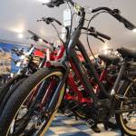 A line of electric-assisted bicycles sit on display at Juneau Bike Doctor Thursday afternoon. Two companion bills introduced this year seeks to revise state code to allow for any e-bikes a part of the generally recognized three-tier classifications of e-bikes to ride anywhere a regular bike would be allowed. (Clarise Larson / Juneau Empire)