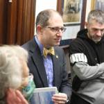 State Sen. Jesse Kiehl, D-Juneau, meets Ukrainian refugees living in Juneau and explains the introduction of them scheduled for Friday’s floor session at the Alaska State Capitol. The Ukrainians remained after the floor session in the hallway outside to meet other legislators and answer questions. (Mark Sabbatini / Juneau Empire)