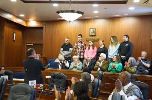 Six Ukrainians who are living in Juneau get a round of applause from state Senators and guests during a floor session Friday, the one-year anniversary of Russias invasion of Ukraine. State Sen. Jesse Kiehl, D-Juneau, introduced the families and read a collective statement from the families thanking locals who have helped resettlement efforts and asking for continuing support of their homeland. (Mark Sabbatini / Juneau Empire)