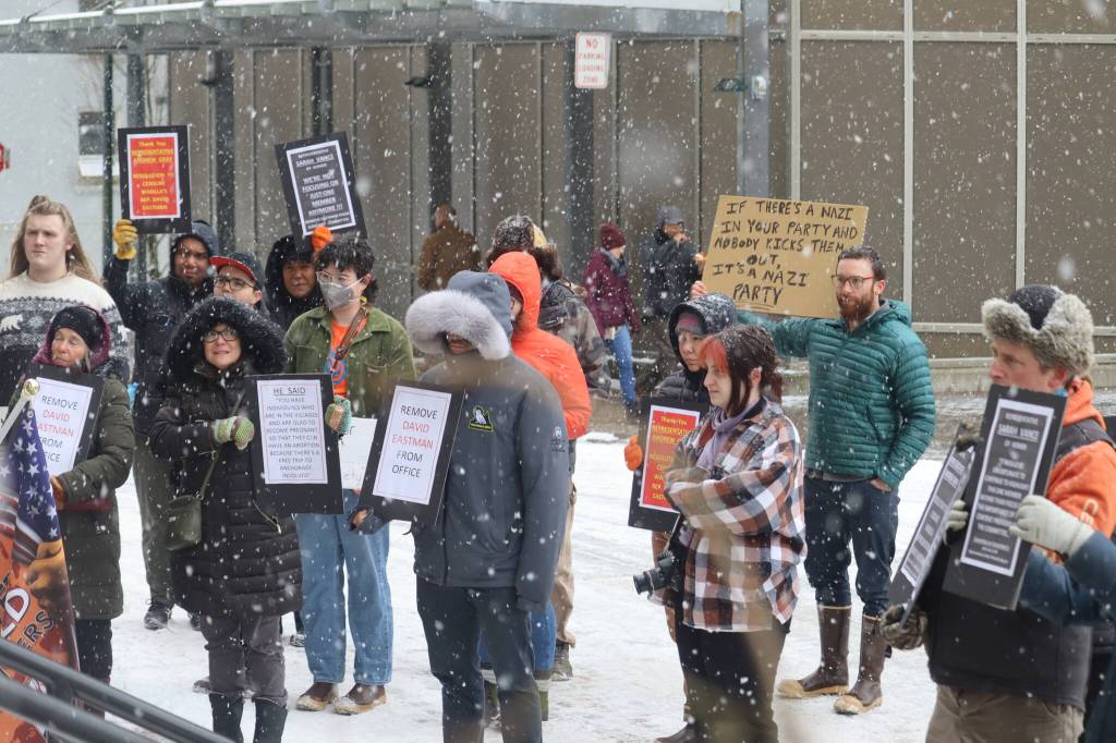 Jonson Kuhn / Juneau Empire 
Protesters at the Alaska State Capitol on Friday hold signs demanding the removal of state Rep. David Eastman, R-Wasilla, and objecting to his questioning if there are economic benefits to the deaths of abused children.