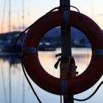 A life preserver hangs on a post at Don. D Statter Harbor Tuesday evening. On Thursday evening, the City and Borough of Juneaus Docks and Harbors board discussed a potential 8.1% increase to all docks and harbors fees starting in July along with an additional 9% increase on top of that to be implemented in the next few years (Clarise Larson / Juneau Empire)