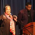 Black Awareness Association president Sherry Patterson and her son and evenings emcee Michael Patterson address a full crowd after leading a prayer at the Juneau Arts and Culture Center on Saturday during Rise, a Black History Month celebration. (Jonson Kuhn / Juneau Empire)