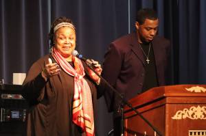 Black Awareness Association president Sherry Patterson and her son and evenings emcee Michael Patterson address a full crowd after leading a prayer at the Juneau Arts and Culture Center on Saturday during Rise, a Black History Month celebration. (Jonson Kuhn / Juneau Empire)