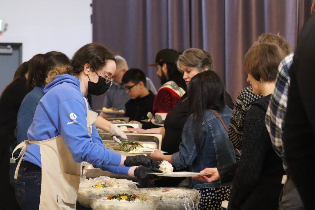 Attendees line up for soul food on Saturday served at the Black Awareness Associations Rise event at the Juneau Arts and Culture Center. The year marks the events first return to Juneau in five years. (Jonson Kuhn / Juneau Empire)
