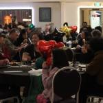 A packed house consisting of Juneau community eats and socializes during Black Awareness Associations Rise event on Saturday at the Juneau Arts and Culture Center. People enjoyed live music, food and raffle desserts, all in celebration of Black History month, as well as a fundraiser for BAAs Black Excellence Scholarship fund. (Jonson Kuhn / Juneau Empire)