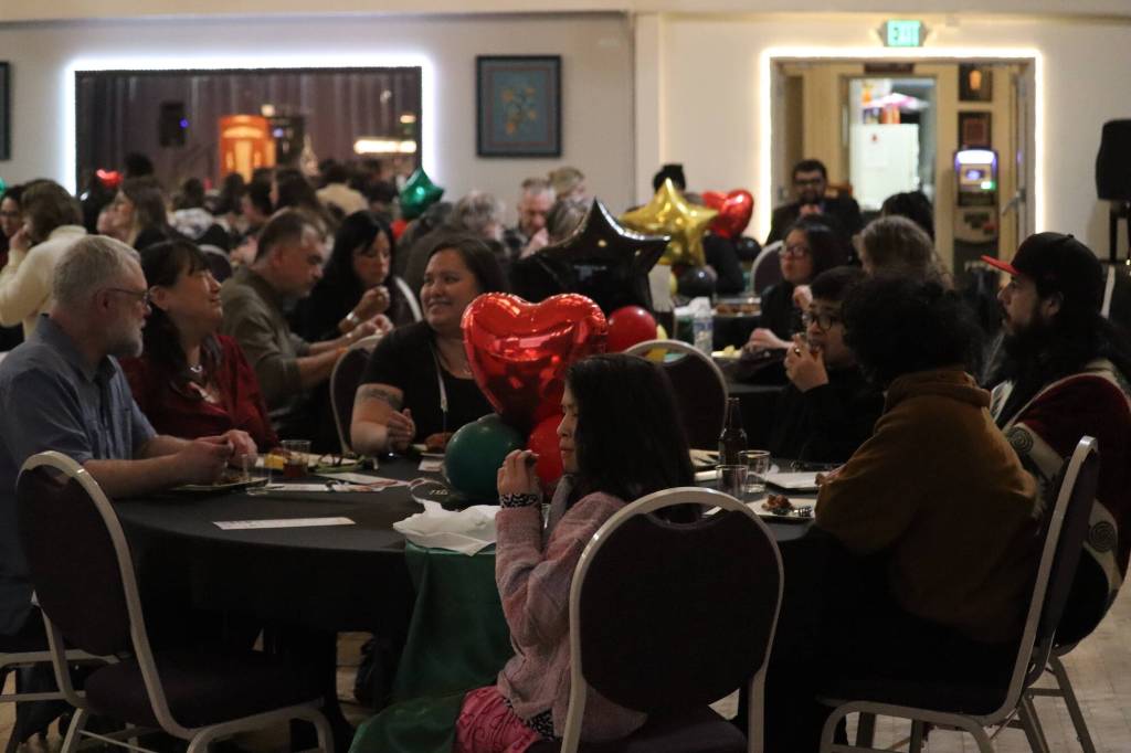 A packed house consisting of Juneau community eats and socializes during Black Awareness Associations Rise event on Saturday at the Juneau Arts and Culture Center. People enjoyed live music, food and raffle desserts, all in celebration of Black History month, as well as a fundraiser for BAAs Black Excellence Scholarship fund. (Jonson Kuhn / Juneau Empire)