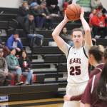 JDHS senior Ashley Laudert, who scored 4 points on Friday and 9 on Saturday against Ketchikan High School, looks for an open pass during Fridays home conference game facing the Lady Knights. (Jonson Kuhn / Juneau Empire)