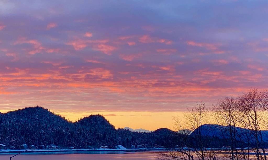 This photo shows a sunset over the Douglas mountains seen from mile 2 Glacier Highway. (Courtesy Photo / Denise Carroll)