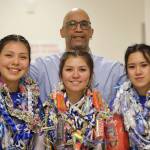 Ben Hohenstatt / Juneau Empire 
TMHS seniors Kiara Kookesh, Kayla Woodbury and Tyra Aguirre pose for a photo with coach Andy Lee on senior night.
