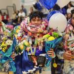 Ben Hohenstatt / Juneau Empire 
TMHS seniors Caden Mercer, MJ Tupou and Sam Sika pose together for a photo on senior night ahead of a win against JDHS.