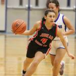 Jonson Kuhn / Juneau Empire 
JDHS senior Kiyara Miller (4) dribbles the ball down court against TMHS on Tuesday night for one of two conference games. Miller tied senior Ashley Laudert for a total of 8 points.