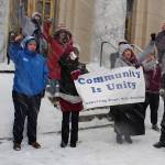 Mark Sabbatini / Juneau Empire 
Alaska residents with disabilities and advocates providing services intended to support self-sufficiency wave a banner and noisemakers during a noontime Wednesday rally in a blizzard on the steps of the Alaska State Capitol.