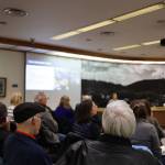 Residents listen to a presentation during an open forum meeting hosted by the City and Borough of Juneau Public Works and Facilities Committee Thursday evening to discuss a proposed second crossing from Juneau to Douglas Island. (Clarise Larson / Juneau Empire)