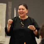 Sonya Kelliher-Combs teaches a youth activity Saturday afternoon where Juneau middle school students were invited to learn how to create a a pouch made from hog intestine and embellished with beads and natural materials. (Clarise Larson / Juneau Empire)