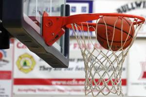 A basketball passes through a hoop at Thunder Mountain High School. Expect to see a lot more of that this week as the Region V Tournament will be hosted at the high school. Games start Wednesday. (Ben Hohenstatt / Juneau Empire File)