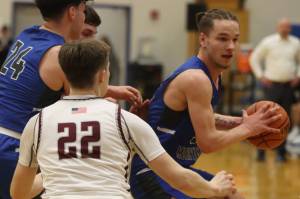 TMHS junior Thomas Baxter plots his next move during the Falcons first game of the Region V 4A Tournament at Thunder Mountain High School. Kayhi prevailed in a close game. Next up for Kayhi, are the conference-leading Crimson Bears. (Jonson Kuhn / Juneau Empire)
