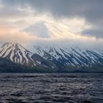 In this photo provided by the Alaska Volcano Observatory/U.S. Geological Survey is the Tanaga Volcano near Adak, Alaska, on May 23, 2021. A swarm of earthquakes occurring over the past few weeks has intensified at a remote Alaska volcano dormant for over a century, a possible indication of an impending eruption. The Alaska Volcano Observatory raised the alert level to advisory status for Tanaga Volcano late Tuesday, March 7, 2023, after the quakes became very vigorous. (Matt Loewen/Alaska Volcano Observatory/U.S. Geological Survey)