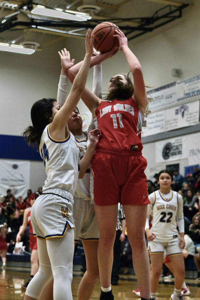 Alysia Nelson-Boyd (11) Wrangell senior Kiara Harrison shoots against Metlakatla during Region V tournament on Thursday. (Klas Stolpe / For the Juneau Empire)
