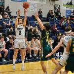Haines Luke Davis (2) shoots over Craigs Josh Bennett (10) during Region V tournament action Wednesday. (Klas Stolpe / For the Juneau Empire)