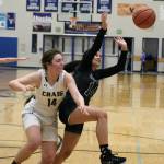 Craigs Alissa Durgan and Haines Alison Benda chase a rebound during the Region V tournament on Wednesday. (Klas Stolpe / For the Juneau Empire)