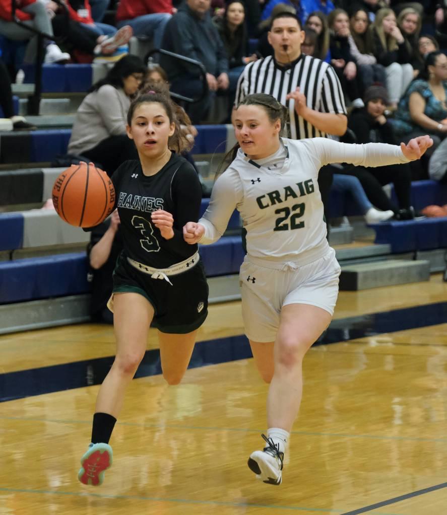 Haines Ariel Godinez Long (3) dribbles against Craigs Makenna Tayor (22) during Region V tournament action on Wednesday. (Klas Stolpe for Juneau Empire) (Klas Stolpe / For the Juneau Empire)
