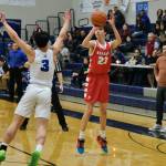 Wrangells Jacen Hay (23) lines up a shot against Petersburgs Rik Cumps (3) during Region V tournament action on Wednesday. (Klas Stolpe / For the Juneau Empire)