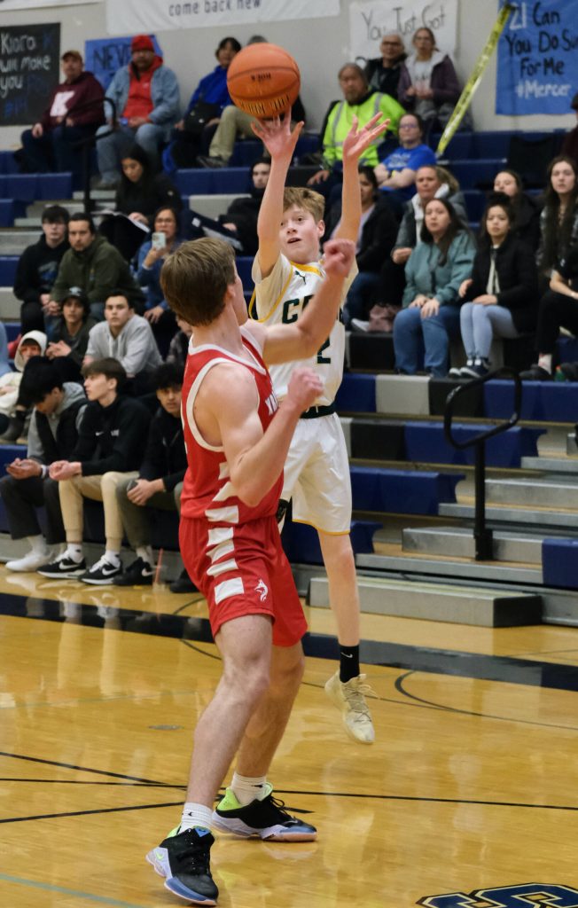 Craigs Brody Bazinet shoots a 3-pointer against Wrangell during the Region V tournament on Thursday. (Klas Stolpe / For the Juneau Empire)