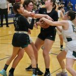 Craig High School senior Alissa Durgan and Amiaya Hansen (15) battle for a ball with Haines senior Malia Jorgenson-Geise and sophomore Ariel Godinez Long (3) during the Lady Panthers 37-31 win over the Lady Glacier Bears in the Region V 2A/4A Basketball Tournament on Wednesday at Thunder Mountain High School in Juneau. (Klas Stolpe / For the Juneau Empire)