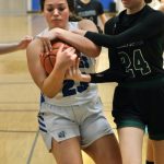 Petersburgs Adarra Curtiss (23) battles for a ball with Haines Raven Hotch (24) during the Region V tournament on Thursday. (Klas Stolpe / For the Juneau Empire)