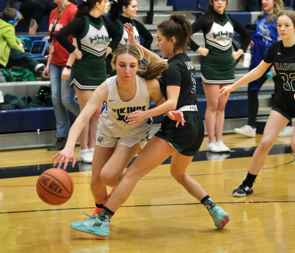 Petersburgs Iris Case (10) drives against Haines Ariel Godinez Long (3) during the Region V tournament on Thursday. (Klas Stolpe / For Juneau Empire)