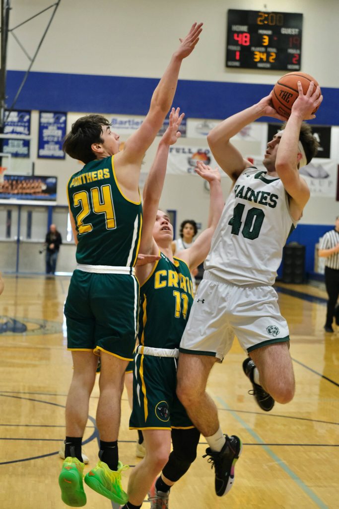Haines High School senior Eric Brouillette (40) shoots over Craig High School sophomore Ayden Benolken (24) and freshman Josh Bennett (10) during the Glacier Bears 68-39 win over the Panthers in the Region V 2A/4A Basketball Tournament on Wednesday, Mar. 8, 2023 at Thunder Mountain High School in Juneau. (Klas Stolpe / For the Juneau Empire)