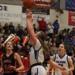 TMHS Ashlyn Gates takes the ball in for a layup against JDHS on Thursday during their second 4A game of the Region V Tournament at TMHS. (Jonson Kuhn / Juneau Empire)