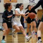 Craig senior Alexis Lawnicki (23) darts through the Haines defense during the second half of a Region V 2A Tournament game at Thunder Mountain High School in Juneau. Lawnicki made layups and sank free throws late that helped put the game away for Craig. (Ben Hohenstatt / Juneau Empire)