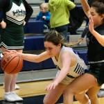 Petersburg junior Bryanna Ratliff is fouled by Haines sophomore Ariel Godinez Long during the Region V basketball tournament on Thursday. Haines eliminated Petersburg from the tournament 38-16. (Klas Stolpe / For the Juneau Empire)