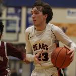 JDHS Joseph Aline takes the ball down court against Ketchikans JJ Parker on Thursday during the Region V Tournament at Thunder Mountain High School. Aline finished the game with a total of 16 points. (Jonson Kuhn / Juneau Empire)