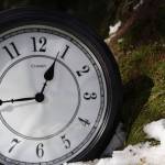 The sun beams down on a clock and nearby melting snow. A bill that calls for Alaska to choose to remain in Daylight Saving Time for the entirety of the year and say farewell to the switch to Standard Time has been reintroduced to the Alaska Legislature this session. (Clarise Larson / Juneau Empire File)