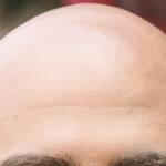 "Bald pride abounds," writes Geoff Kirsch. "In fact, a Bald Men Club of Japan holds an annual Bald Man Competition. In this Olympic-style international tournament, two men stick suction cups to their heads, attached to a single red rope, and then attempt to pull off their opponent’s cup, tug-of-war style. Better start training for next year; I wonder what the rules say about Spider Tack…" (Unsplash /  Chalo Garcia)