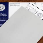 A by-mail general ballot is sent to an Alaska voter in October of 2020. Concern is being expressed by some state lawmakers about such ballots frequently being received and used by people who became residents of other states many years ago. Officials with the state Division of Elections said keeping such people on voter rolls is based on an intention to return to Alaska, which often cannot be definitely determined. (Ben Hohenstatt / Juneau Empire file)