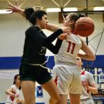 Klas Stolpe / For Juneau Empire 
Haines senior Grace Long Godinez (2) passes around the defense of Wrangell senior Kiara Harrison (11) during an elimination game at the Region V tournament on Friday.