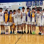 The Metlakatla Chiefs pose for a team photo after winning the Region V championship over Petersburg on Friday. (Klas Stolpe / For the Juneau Empire)