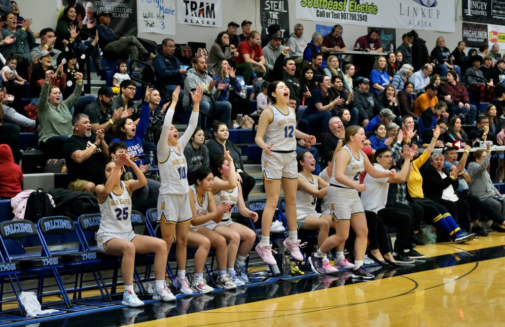 Metlakatla MisChiefs players celebrate a made basket during their 47-18 win over the Craig Lady Panthers in the 2A Region V Championship Game at Juneaus Thunder Mountain High School on Friday. (Klas Stolpe / For the Juneau Empire)