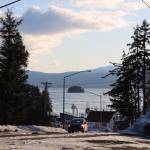 A car drives up a hill near Auke Bay in early March. Transportation was a popular topic in a recent draft report that found lower greenhouse gas emissions in Juneau when comparing 2010 to 2021. (Clarise Larson / Juneau Empire)