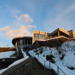 The sun partially sines on the Mendenhall Glacier Visitor Center as it sets in late February. (Clarise Larson / Juneau Empire File)