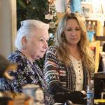 Kristi Elliott, owner of Juneau International Airports gift shop Hummingbird Hollow Gifts, stands with Debra Holman to review inventory. If the airport moves forward with proposed plans to reconfigure the allocated space for the gift shop, Elliott said it could dramatically limit the current wide selection of inventory Hummingbird Hollow Gifts offers, which then cuts down their overall revenue. (Jonson Kuhn / Juneau Empire)