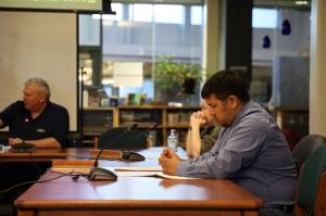 Juneau School Board member Martin Stepetin listens during the discussion Tuesday night as the board finalizes the districts budget. (Clarise Larson / Juneau Empire)