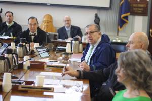 Mark Sabbatini / Juneau Empire 
State Sen. Lyman Hoffman, D-Bethel, asks Randy Bates, director of the Division of Water for the Alaska Department of Environmental Conservation, about state water quality regulations some fish hatcheries are calling harmful during a Senate Finance Committee meeting Friday. The meeting was to review the DECs proposal to take over responsibility for many federal Clean Water Act permits, claiming it will be more responsible and efficient for development projects. Some of the senators questioned both the cost of the state taking over a process currently funded by the federal government, as well as the states ability to properly due to the job within the guidelines for such a takeover.